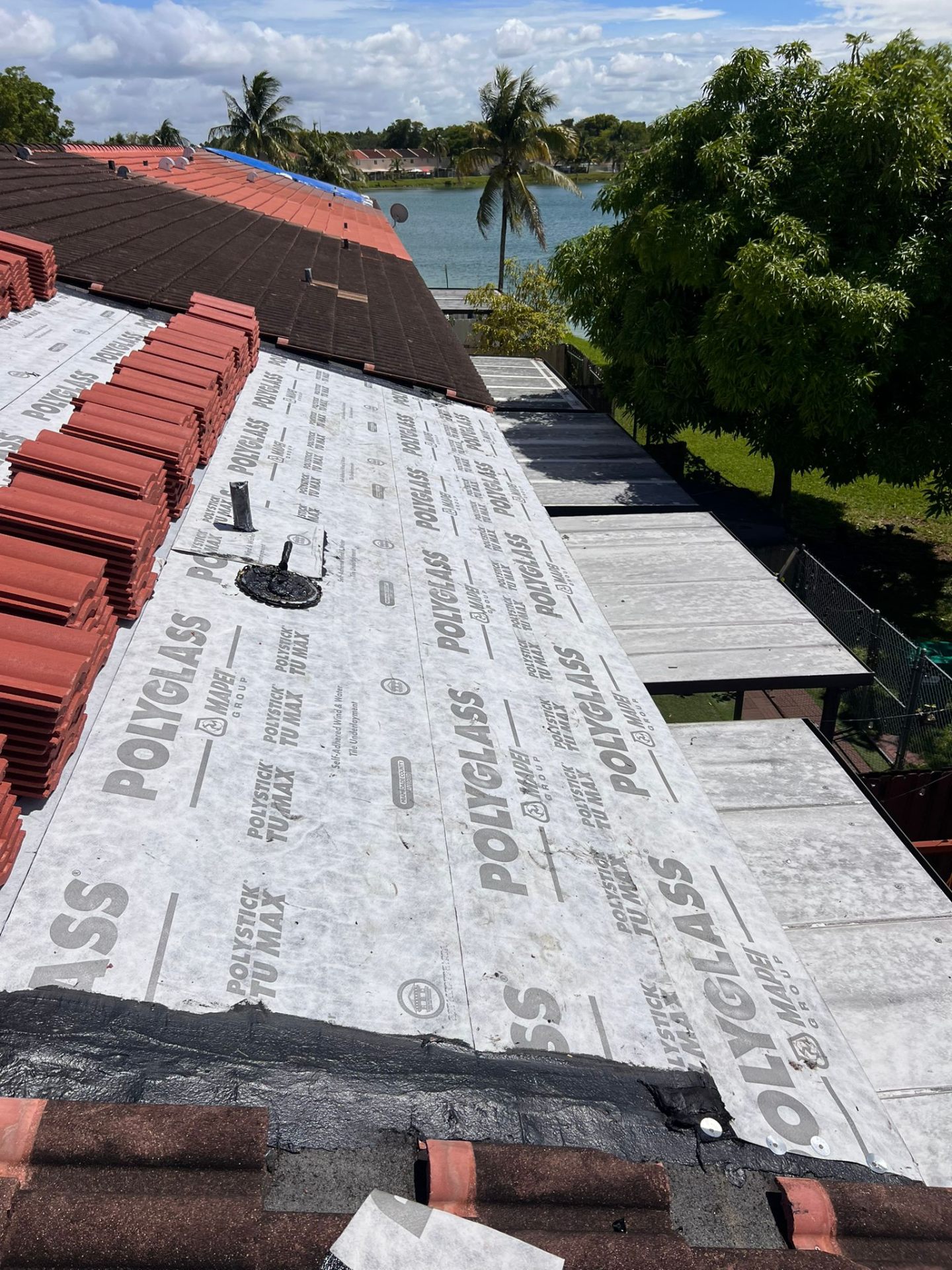 Low-slope commercial roof on a Miami building undergoing roof repair